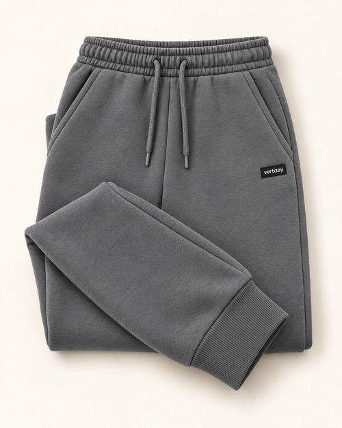 Folded slate Drift joggers showing waistband, drawstring and vertizay label.
