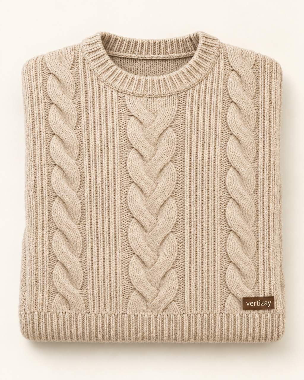Folded Hearth oatmeal sweater showing cable-knit texture and vertizay label.