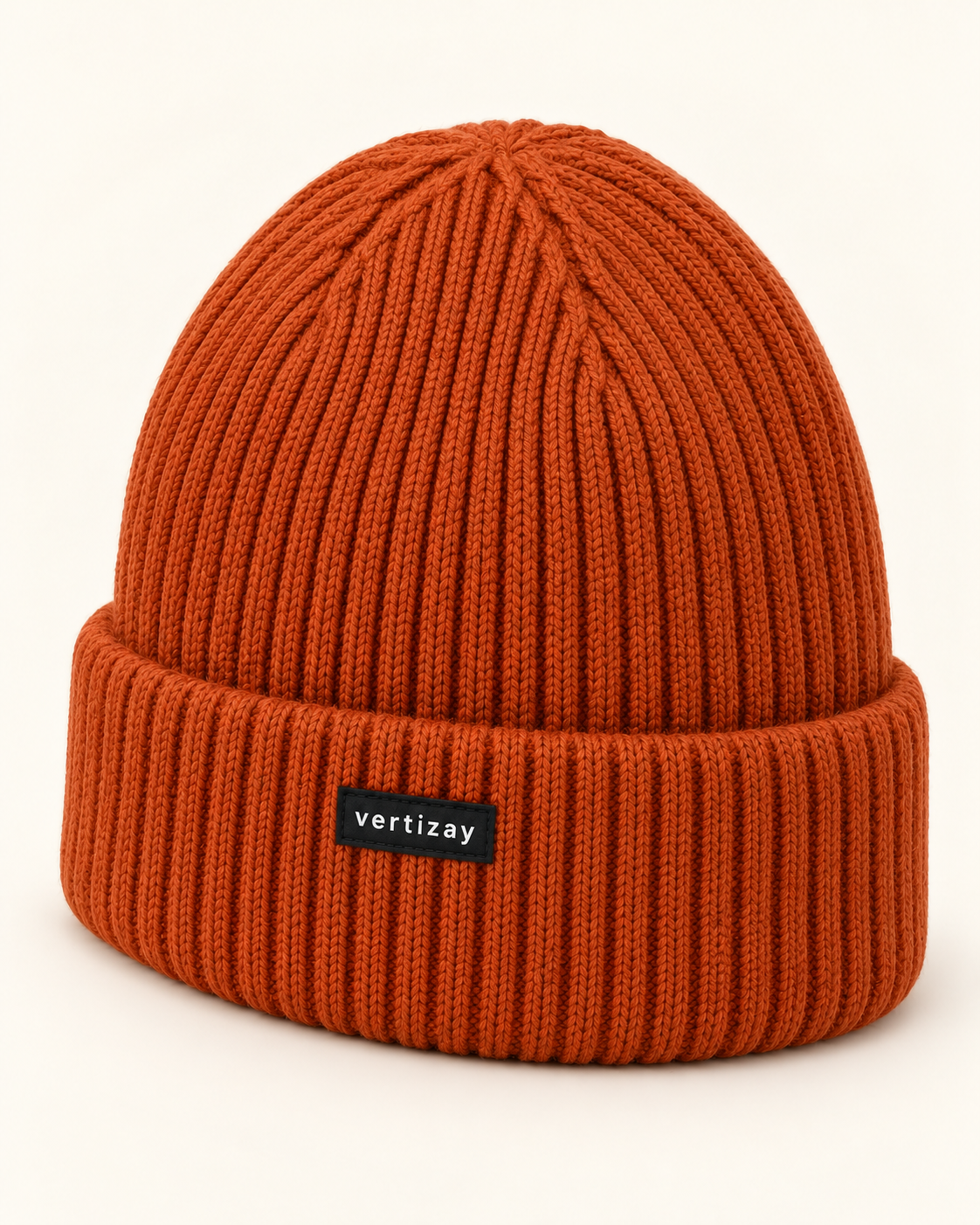 Angled view of the rust Summit beanie showing ribbed texture, cuff and vertizay label.